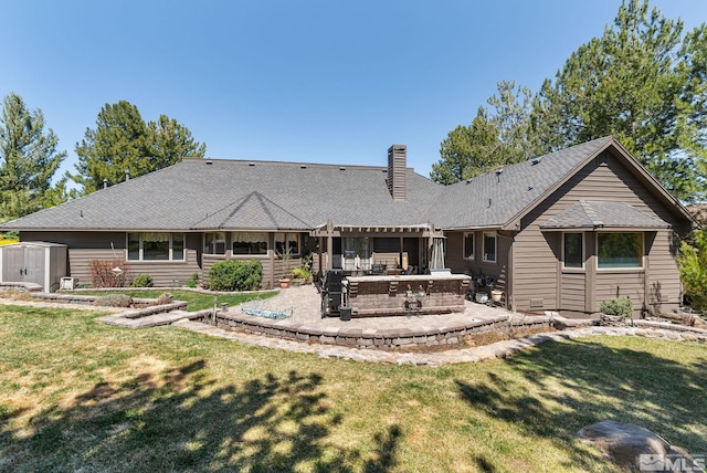 4300 Wild Eagle Ter, Reno, NV 89511 - rear view of property with a patio, a pergola, a storage shed, a chimney, and a yard