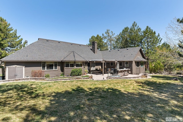 4300 Wild Eagle Ter, Reno, NV 89511 - rear view of house featuring a patio, a chimney, a lawn, a storage shed, and an outdoor structure