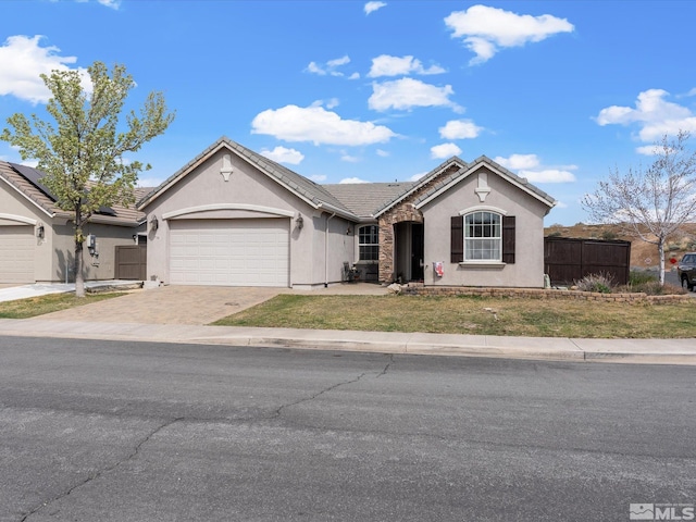 7730 Opal Blf, Reno, NV 89506 - ranch-style home with stucco siding, a garage, driveway, and a tile roof