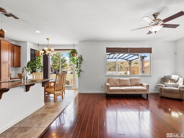 7730 Opal Blf, Reno, NV 89506 - living room featuring a chandelier, baseboards, dark wood-type flooring, recessed lighting, and ceiling fan