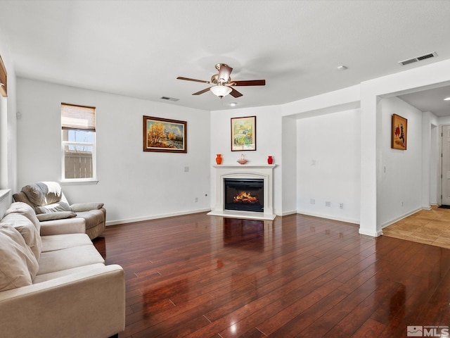 7730 Opal Blf, Reno, NV 89506 - living room with a ceiling fan, a glass covered fireplace, wood finished floors, and baseboards