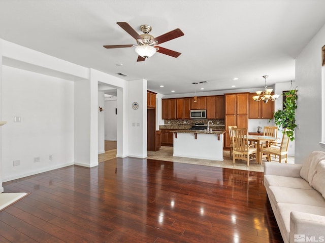 7730 Opal Blf, Reno, NV 89506 - living room with hardwood / wood-style flooring, a chandelier, recessed lighting, baseboards, and ceiling fan