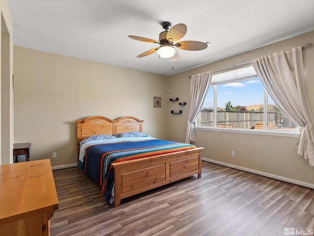 7730 Opal Blf, Reno, NV 89506 - bedroom featuring baseboards, wood finished floors, and a ceiling fan