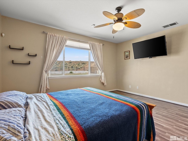 7730 Opal Blf, Reno, NV 89506 - bedroom with wood finished floors, baseboards, and ceiling fan