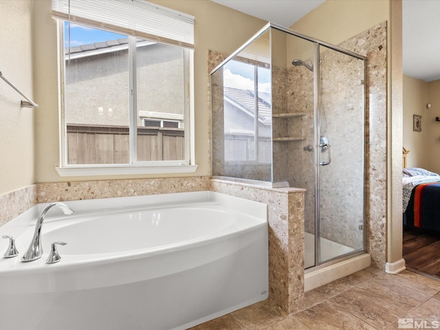 7730 Opal Blf, Reno, NV 89506 - ensuite bathroom featuring healthy amount of natural light, a shower stall, and a garden tub