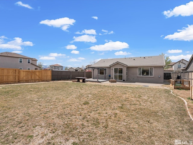 7730 Opal Blf, Reno, NV 89506 - back of property featuring a patio, a tile roof, and stucco siding