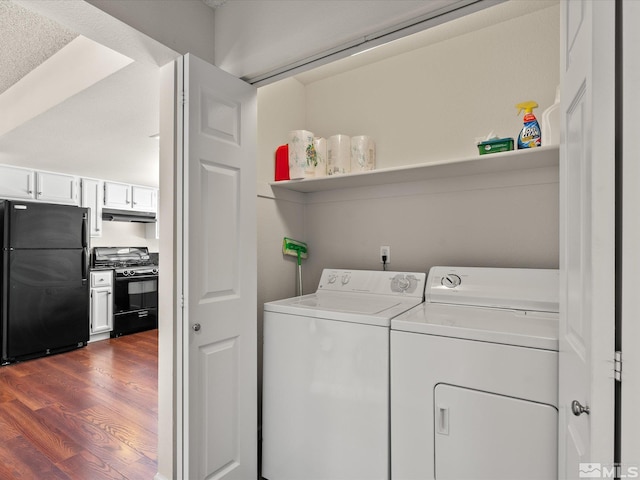 laundry area featuring washing machine and dryer and dark wood-style floors