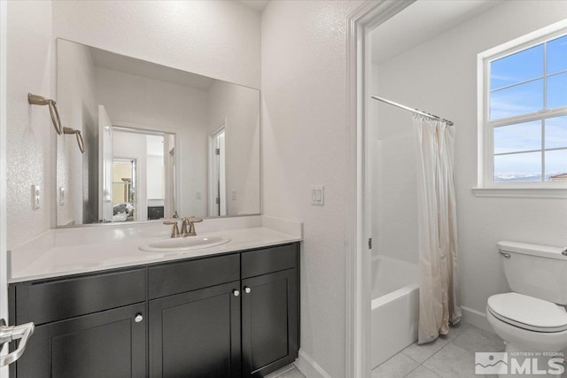 3204 Constantine Dr, Sparks, NV 89434 - bathroom with toilet, vanity, tile patterned floors, baseboards, and shower / tub combo with curtain
