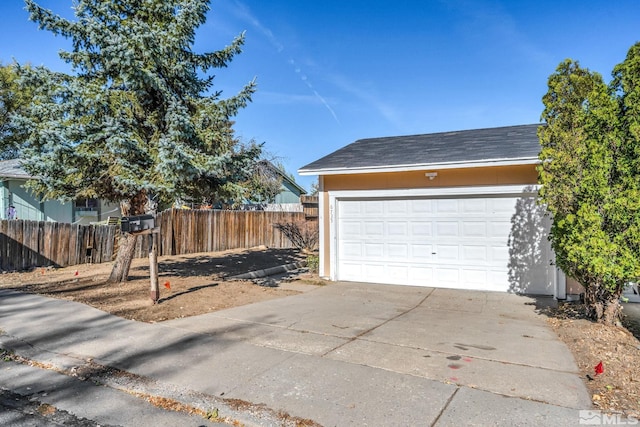 6735 Peppermint Dr, Reno, NV 89506 - garage with fence and concrete driveway