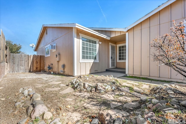 6735 Peppermint Dr, Reno, NV 89506 - rear view of house with fence and board and batten siding