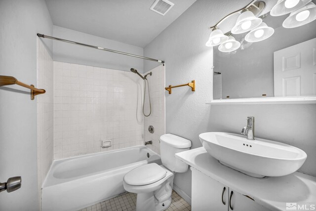 6735 Peppermint Dr, Reno, NV 89506 - full bath with toilet, tile patterned floors, a sink, shower / bath combination, and baseboards