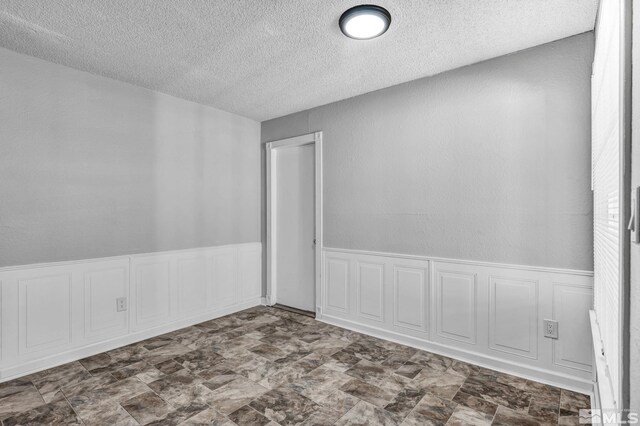 6735 Peppermint Dr, Reno, NV 89506 - spare room featuring a textured ceiling