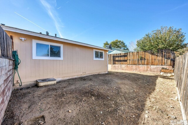 6735 Peppermint Dr, Reno, NV 89506 - view of side of home featuring a fenced backyard