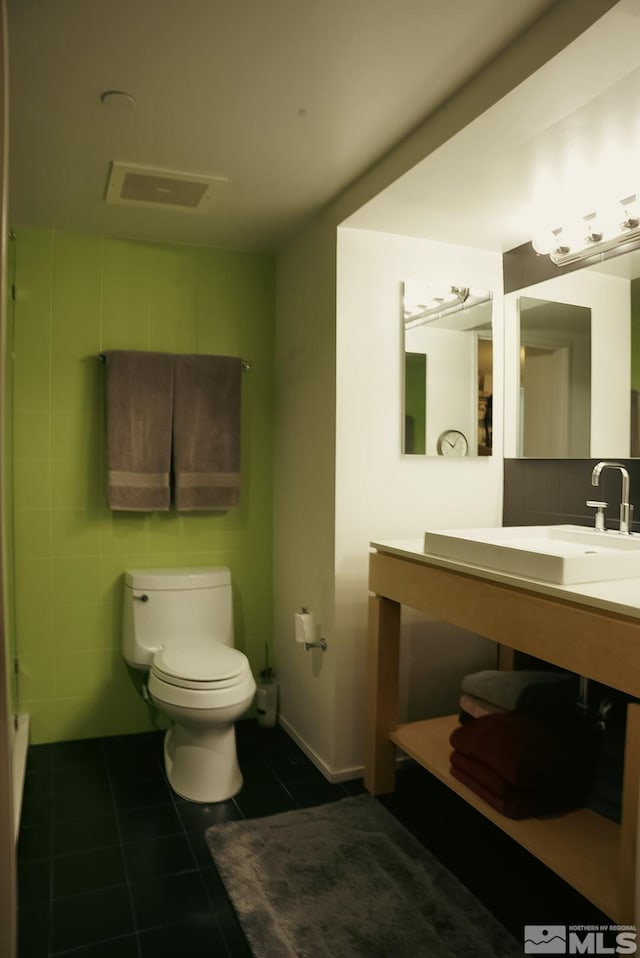 255 N Sierra St Unit 708, Reno, NV 89501 - bathroom featuring tile patterned flooring, toilet, and vanity