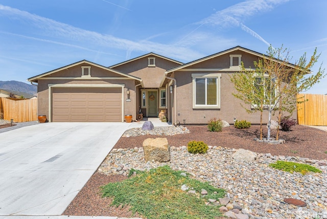 1180 Ferretto Pkwy, Dayton, NV 89403 - ranch-style house featuring fence, stucco siding, an attached garage, and driveway