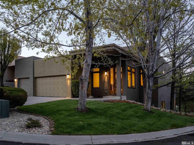 2531 Edgerock Rd, Reno, NV 89519 - view of front of house featuring an attached garage, a front yard, stucco siding, and concrete driveway