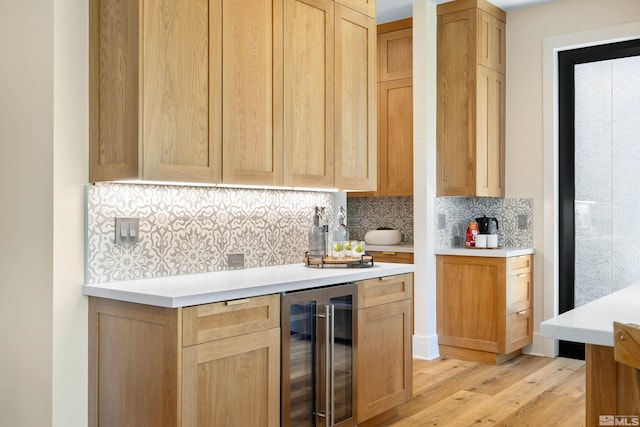 2531 Edgerock Rd, Reno, NV 89519 - bar area with beverage cooler, light wood-type flooring, and tasteful backsplash