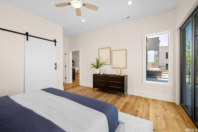 2531 Edgerock Rd, Reno, NV 89519 - bedroom with a barn door, light wood finished floors, baseboards, recessed lighting, and ceiling fan