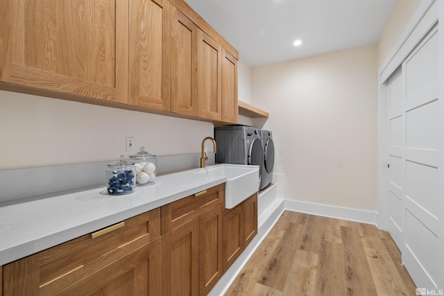 2531 Edgerock Rd, Reno, NV 89519 - washroom featuring separate washer and dryer, cabinet space, baseboards, light wood finished floors, and recessed lighting