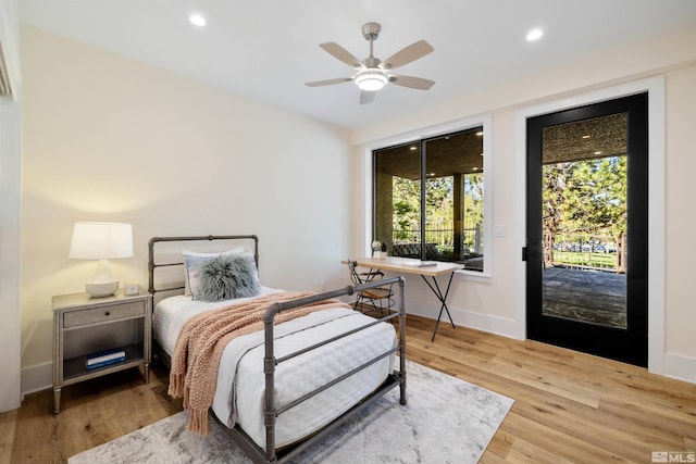 2531 Edgerock Rd, Reno, NV 89519 - bedroom with access to outside, multiple windows, wood finished floors, recessed lighting, and baseboards