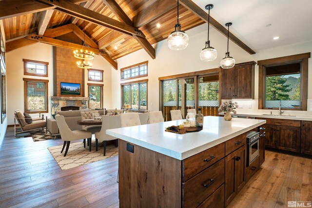 534 Headwaters Way, Carson City, NV 89705 - kitchen featuring a sink, high vaulted ceiling, beam ceiling, light countertops, and light wood-style floors