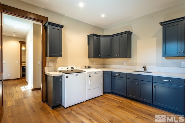 534 Headwaters Way, Carson City, NV 89705 - laundry room with cabinet space, washer and dryer, light wood-style flooring, and recessed lighting