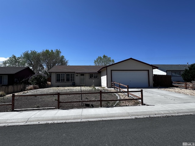2037 Lonnie Ln, Dayton, NV 89403 - ranch-style house with a fenced front yard, concrete driveway, and an attached garage