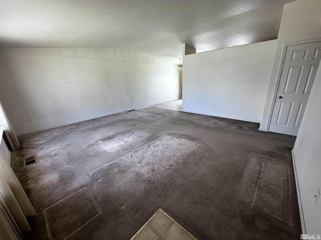 2037 Lonnie Ln, Dayton, NV 89403 - unfurnished room with carpet flooring, vaulted ceiling, and baseboards
