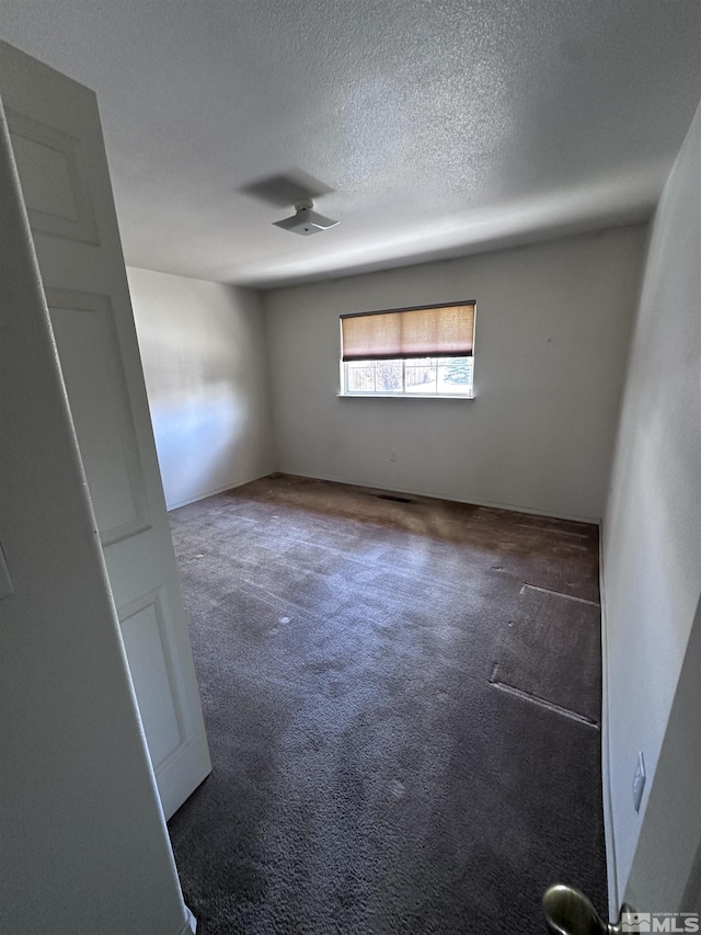 2037 Lonnie Ln, Dayton, NV 89403 - empty room featuring carpet and a textured ceiling