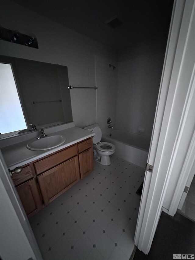 2037 Lonnie Ln, Dayton, NV 89403 - bathroom with toilet, vanity, tile patterned floors, and  shower combination