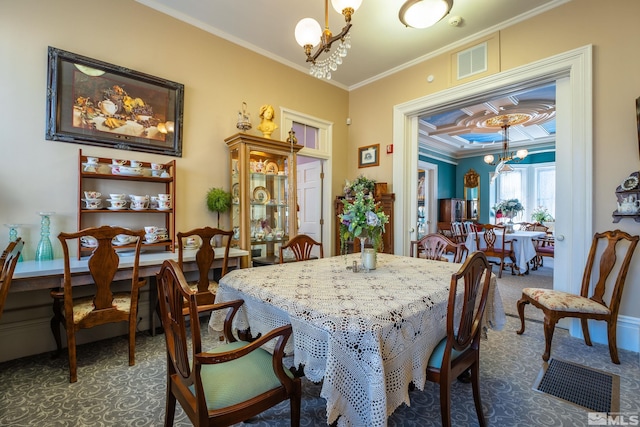 102 N Curry St, Carson City, NV 89703 - dining room featuring a chandelier, dark carpet, and crown molding