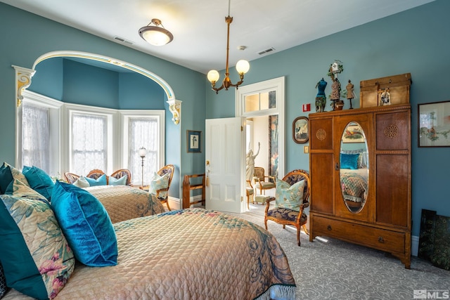 102 N Curry St, Carson City, NV 89703 - bedroom featuring carpet floors and a chandelier