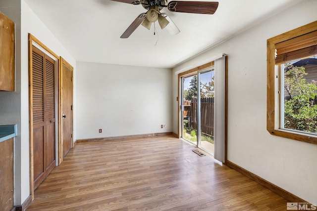 3301 Everett Dr, Reno, NV 89503 - unfurnished bedroom with access to exterior, light wood-type flooring, baseboards, and ceiling fan