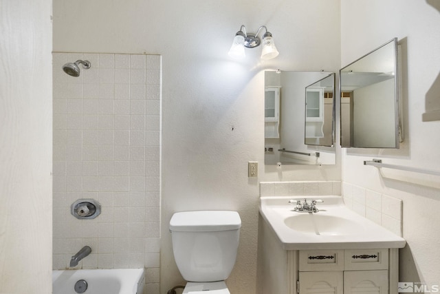3301 Everett Dr, Reno, NV 89503 - bathroom featuring toilet, vanity, and bathing tub / shower combination