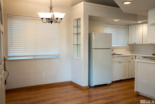 2621 Fanto Ct, Sparks, NV 89431 - kitchen featuring freestanding refrigerator, white cabinets, dark wood-style floors, a sink, and a chandelier