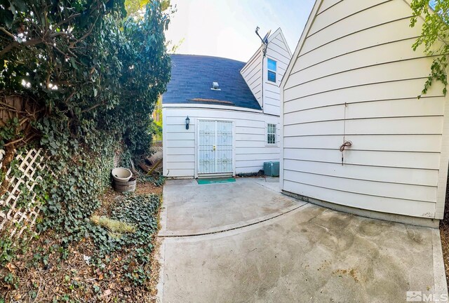 2621 Fanto Ct, Sparks, NV 89431 - back of property featuring a patio, roof with shingles, and central air condition unit