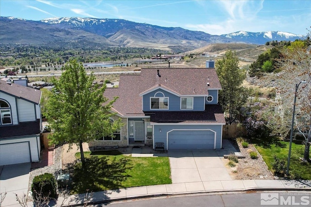4776 Scenic Hill Cir, Reno, NV 89523 - traditional-style home featuring driveway, an attached garage, a mountain view, and fence