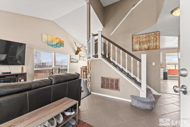 4776 Scenic Hill Cir, Reno, NV 89523 - living room featuring stairs, lofted ceiling, and baseboards