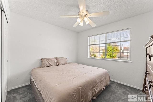 4776 Scenic Hill Cir, Reno, NV 89523 - bedroom featuring dark carpet, baseboards, a textured ceiling, and ceiling fan
