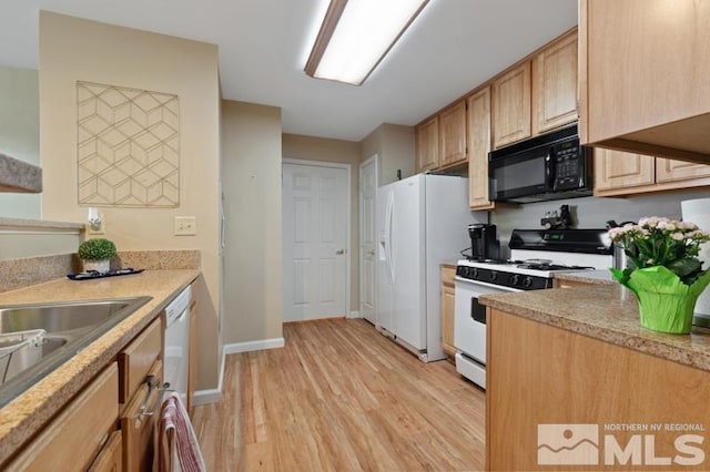 900 S Meadows Pkwy Unit 614, Reno, NV 89521 - kitchen featuring white appliances, light wood-type flooring, baseboards, and light brown cabinetry