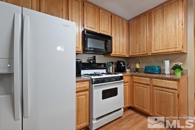 900 S Meadows Pkwy Unit 614, Reno, NV 89521 - kitchen featuring white appliances, light countertops, and light wood-type flooring