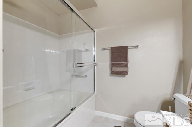 900 S Meadows Pkwy Unit 614, Reno, NV 89521 - full bathroom with toilet, tile patterned floors, combined bath / shower with glass door, and baseboards