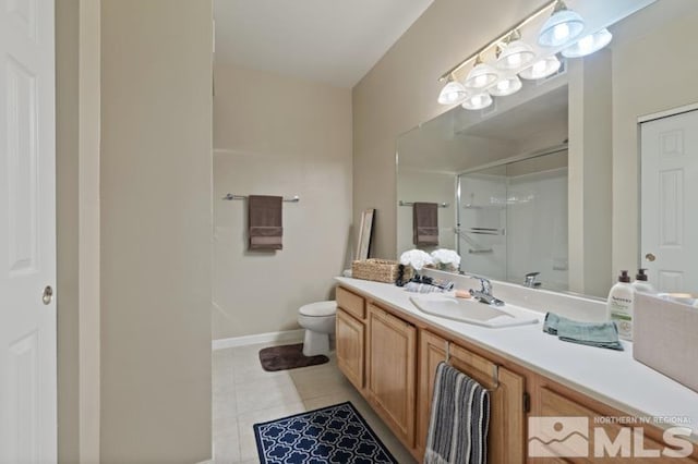 900 S Meadows Pkwy Unit 614, Reno, NV 89521 - bathroom with a stall shower, tile patterned floors, vanity, toilet, and baseboards