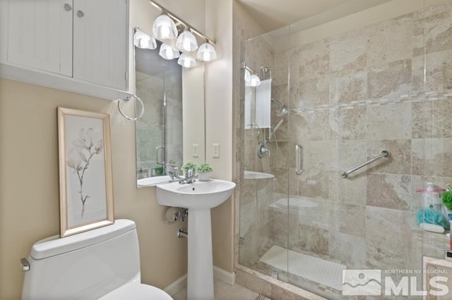 900 S Meadows Pkwy Unit 614, Reno, NV 89521 - bathroom with a shower stall, toilet, and baseboards