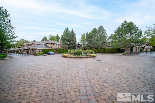 900 S Meadows Pkwy Unit 614, Reno, NV 89521 - view of road featuring a gate, a gated entry, and curbs