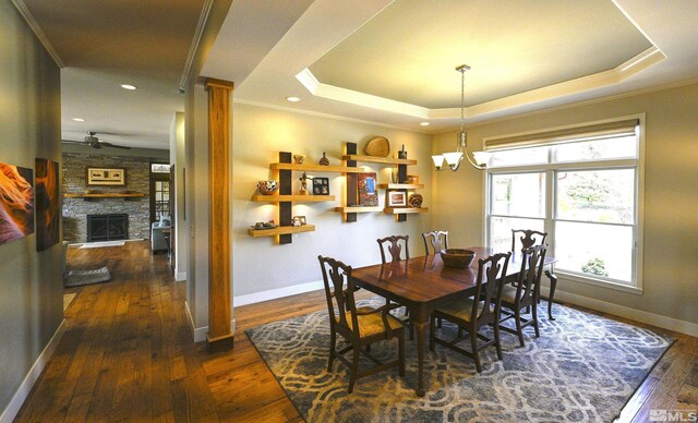 2057 W Washington St, Carson City, NV 89703 - dining space with ceiling fan, dark wood finished floors, ornamental molding, a chandelier, and baseboards