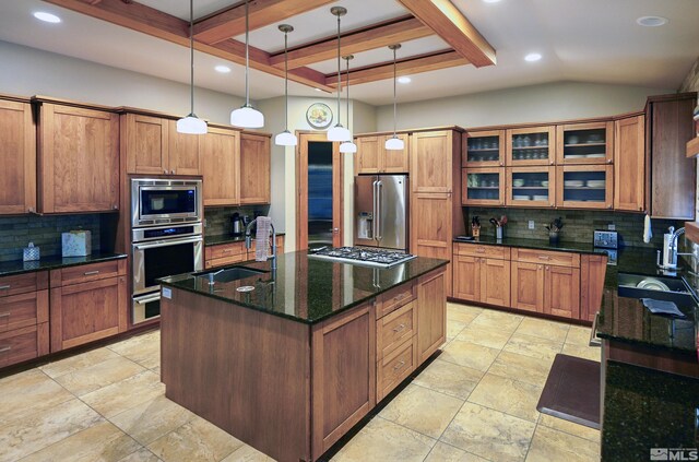 2057 W Washington St, Carson City, NV 89703 - kitchen featuring appliances with stainless steel finishes, a sink, backsplash, an island with sink, and recessed lighting