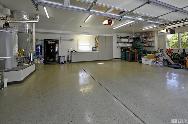 2057 W Washington St, Carson City, NV 89703 - garage with water heater, a garage door opener, and heating unit
