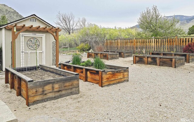 2057 W Washington St, Carson City, NV 89703 - view of yard featuring a garden and a mountain view