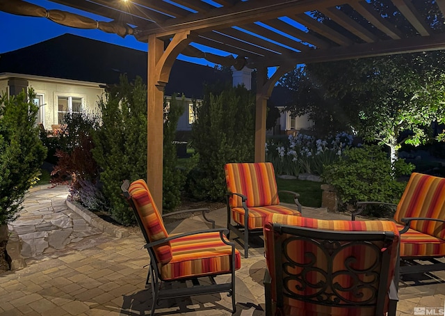 2057 W Washington St, Carson City, NV 89703 - patio at night with a patio area, a pergola, and an outdoor living space